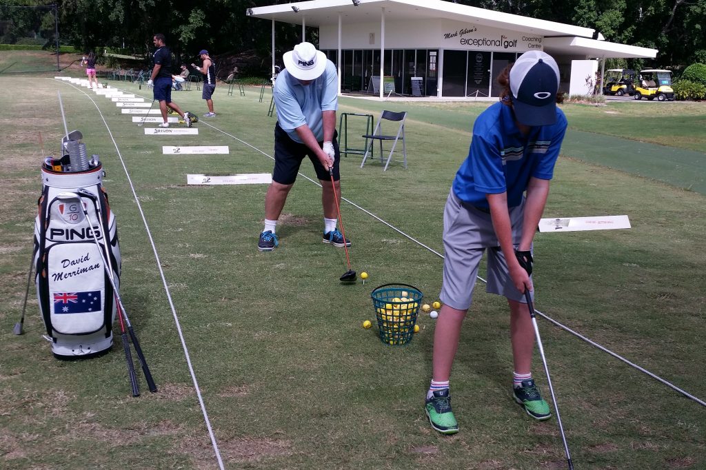 David and Dylan practice for the golf course