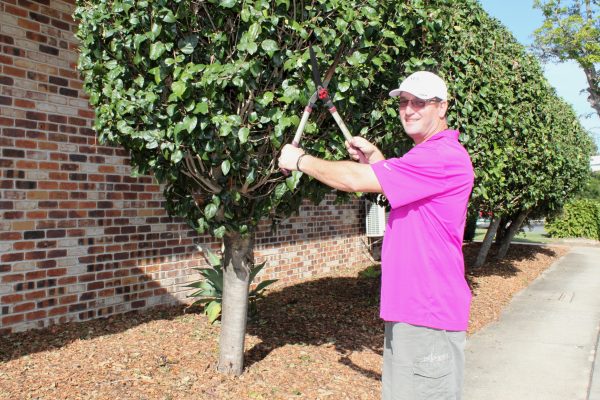 HANDS-ON: No job is too big or small for Nudgee Golf Club’s general manager Aaron Muirhead.