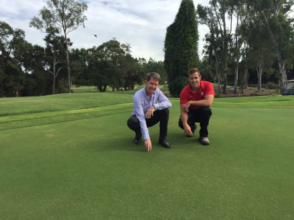 The Brisbane Golf Club captain Terry Campbell and golf course superintendent Mitch Hayes show off the news greens