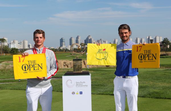 Incheon, South Korea: Brett Coletta (left,runner-up) and Curtis Luck (right, champion) of the 2016 Asia-Pacific Amateur Championship holding The Open and the Masters flags next to the AAC Trophy at the Jack Nicklaus Golf Club in Korea on October 9th, 2016. (Photo by AAC)