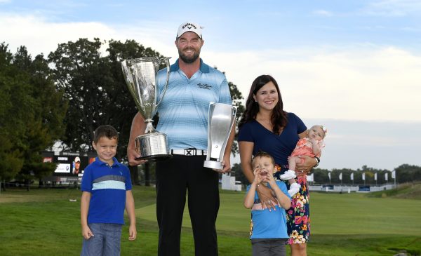 Audrey and Marc Leishman pose with their sons Harvey, left, and Ollie after the final round of the BMW Championship at Conway Farms Golf Club  (Photo by Stan Badz/PGA TOUR)