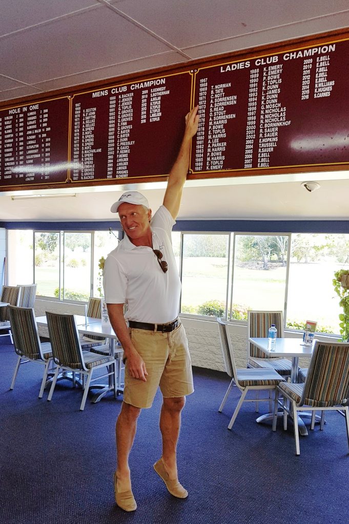 Long before Greg Norman was world number one, his mother Toini was top of the pops when she became the first women’s club champion at Rowes Bay Golf Club. On tippy toes, the Shark points to her name on the honourboard.