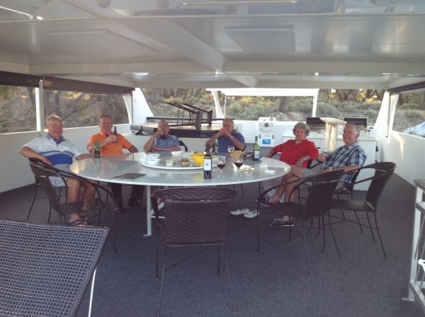 Guests enjoy drinks on the upper deck during a Murray River Magic cruise