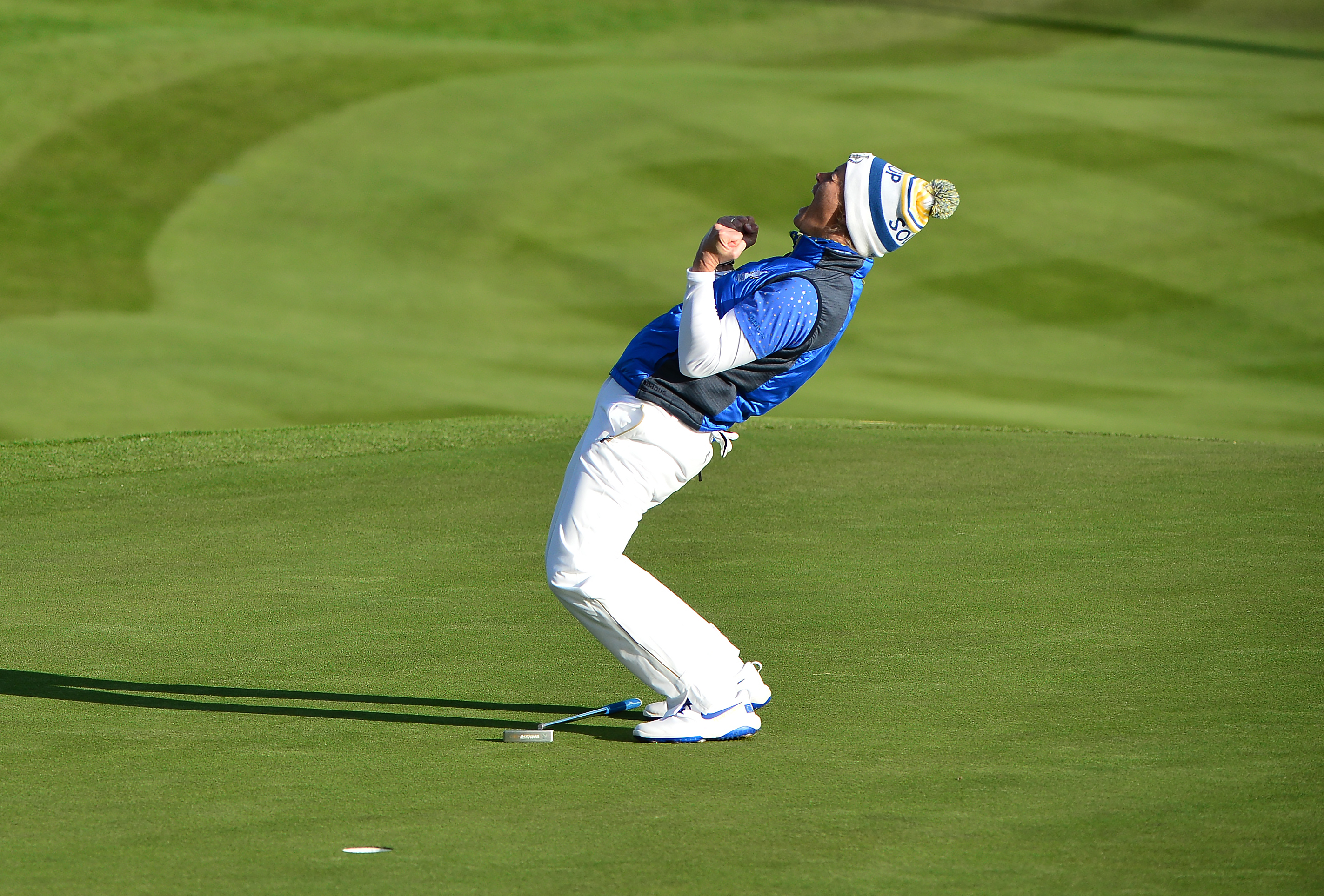 Suzann Pettersen of Norway reacts on the 18th green as she sinks her final putt to help Europe win the Solheim Cup